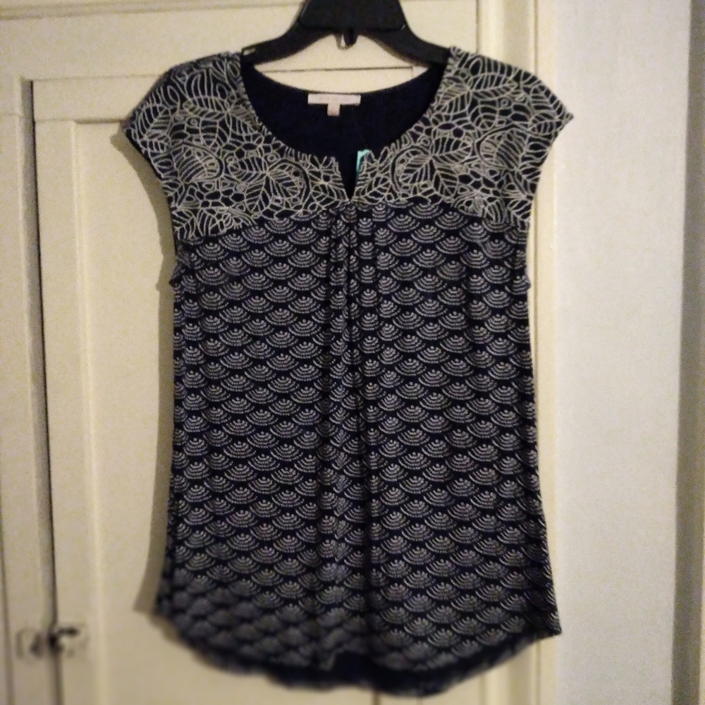 Short sleeve Skies are Blue navy with white detail top. NwT